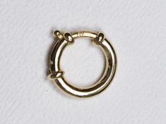 ♥ This is a 14k gold large spring ring / sailor clasp ♥ Use this to connect two chains together, or as the clasp for a statement necklace ♥ Out diameter of the spring ring measures 13mm ♥ The necklace chain is *NOT INCLUDED*. You can purchase the solid 14K gold chain as an option, or use one of your existing chains for the pendant. ♥ Material: 14K gold ♥ Free shipping in the US. ♥ This item is made-to-order and non-refundable. Please refer to our Shop Announcement section to see the latest produ Timeless Yellow Gold Jewelry With Box Clasp, Heirloom Gold Jewelry With Box Clasp, Heirloom Style Yellow Gold Jewelry With Box Clasp, Luxury 14k Gold Jewelry With Spring Ring Clasp, Yellow Gold Jewelry With Lobster Clasp, Round Yellow Gold Jewelry With Lobster Clasp, Classic Yellow Gold Jewelry With Box Clasp, Luxury Round Jewelry With Gold Clasp, Classic Hoop Rings With Spring Ring Clasp