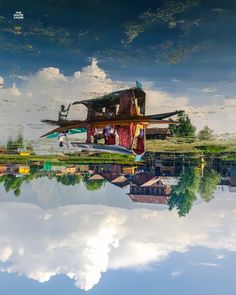 an airplane is floating in the water with people on it's roof and windows