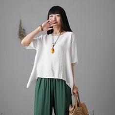 ★★ FEATURES* 50% linen, 50% cotton* Medium weight linen* crew neck line* Short sleeve* Loose waist fit* Asymmetrical hem* Plus size Linen blouse* Perfect for summer* More colors* Wash only in cold water and do not expose to direct sunlight.* Want the green pants? Select fromhttps://etsy.me/2Sn4eqtSize Chart https://etsy.me/3skS1Aq★★Mode sizeHeight 162 cm (5′ 4″) Bust 84 cm (33") Waist 66 cm (26") She wears size XS/S★★ When to select Bespoke size Your height is not between 157 cm- 173 cmYour weig Asymmetrical Lagenlook Top In Solid Color, Lagenlook Solid Color Top With Asymmetrical Hem, Lagenlook Solid Top With Asymmetrical Hem, Oversized Tops With Asymmetrical Hem In Solid Color, Oversized Solid Color Tops With Asymmetrical Hem, Lagenlook Solid Color Summer Tops, Casual Asymmetrical Summer Shirt, Casual Shirt With Asymmetrical Hem And Relaxed Fit, Casual Shirt With Relaxed Fit And Asymmetrical Hem