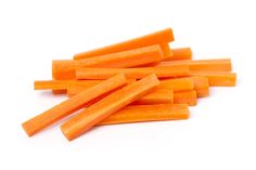 small orange carrot sticks on a white background