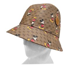 Mickey Monogram Bucket Hat by Disney X Gucci Spring/Summer 2020 Made in Italy Brown with vintage Gucci monogram throughout Mickey Mouse graphic intermixed throughout Interlocking G Gucci logo stamped on leather patch Fabric Composition; 50% polyester, 50% cotton, (100% cotton lining) New With Tags, Includes Original Hat Box Size/Measurements: (approximate, taken flat) Size Medium 58 cm (22.83") Philip Treacy, Gucci Spring, Gucci Vintage, Gucci Logo, Gucci Monogram, Hat Box, Berets, Logo Stamp, Leather Patches