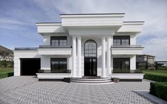 a large white house with columns on the front and two black doors at the entrance