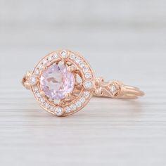 This is a new Beverley K engagement style ring. Gem: Natural Diamonds - 0.12 Total Carats, Round Brilliant Cut, F - G Color, VS2 - SI2 Clarity - Morganite - 0.50 Carats, Round Brilliant Cut, Pink Color Metal: 14k Rose Gold Weight: 3 Grams Stamps: 14k bkc BK Face Height: 10.8 mm Rise Above Finger: 6.7 mm This ring is a size 6 1/2, but it can be resized down 2 sizes for a $40 fee or up 3 sizes for a $100 fee. If you would like your ring resized, please select the appropriate fee from the listing b Rose Gold Sapphire Ring With Halo, Rose Gold Sapphire Ring With Diamond Halo, Rose Gold Sapphire Halo Ring, 14k Rose Gold Diamond Ring With Halo Setting, 14k Rose Gold Halo Setting Diamond Ring, 14k Rose Gold Gemstone Wedding Jewelry, 14k Rose Gold Halo Ring, Rose Gold Gemstone Halo Ring In Fine Jewelry Style, Rose Gold Gemstone Halo Ring Fine Jewelry