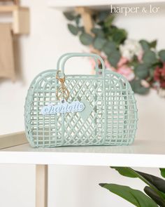 a blue purse sitting on top of a white shelf