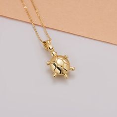 Introducing our Elegant Turtle Pendant, a masterpiece of minimalist gold jewelry crafted from 14K solid gold. This exquisite turtle necklace is designed for those who appreciate the beauty of simplicity and elegance. Whether you're searching for the perfect Christmas gift for her or a special addition to your own collection, this sea turtle necklace is sure to make a lasting impression. The pendant's delicate design symbolizes strength, longevity, and protection, making it a meaningful piece to Minimalist Gold Jewelry, Gold Minimalist Jewelry, Sea Turtle Necklace, Turtle Jewelry, Turtle Necklace, Turtle Pendant, Christmas Gift For Her, Jewelry Christmas, Necklace Minimalist