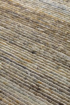 an area rug with brown and white stripes