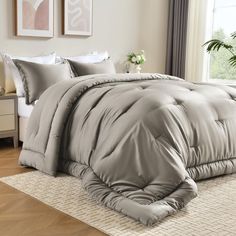 the comforter is made up and ready for someone to use it in their bed