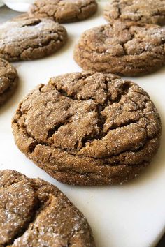 chocolate cookies are lined up on a cutting board