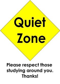 a yellow sign with the words quiet zone on it