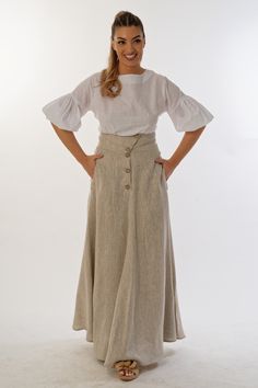 This summer linen skirt is a classic garment, it is made of 100% linen, the wide belt and asymmetrical fastening make you unique. It is also cut with side pockets, fits gently and emphasizes femininity. This is a versatile skirt that you will wear again and again. ● The model is 5'9″ (175cm) tall ● The model is a М ➤ Material Linen When washing, colour remains the same brightness. WE DO CUSTOM FITTING Every client for us is special. Send us your specific preferences if needed. No extra cost. Min Elegant Linen Bottoms With Buttons, Elegant Relaxed Maxi Skirt With Buttons, Elegant Buttoned Flared Maxi Skirt, Elegant Summer Maxi Skirt With Buttons, Elegant Flared Maxi Skirt With Buttons, Beige Long Skirt With Buttons, Beige Buttoned Long Skirt, Beige Linen Wide Leg Maxi Skirt, Luxury Linen Flowy Maxi Skirt