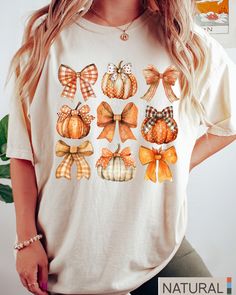 Retro Fall Pumpkin Bow Shirt, Fall Coquette Bow Sweatshirt, Autumn Pumpkin Tee, Fall T-Shirt , Autumn Sublimation Design, Autumn Bow Shirts -UNISEX T-SHIRTS - Women typically wear one size down for a fitted look. -The Models in the pictures are wearing 2 sizes up, Please order 2 sizes up for an oversized look DETAILS AND FABRIC: * Comfort Colors 1717 * 100% ring-spun cotton How you order: Select your size and the color that you want from the drop down bar, add to cart, and check out.  How to ord Cute White Fall Shirt, Cute White Shirt For Fall, White Short Sleeve Shirt For Fall, White Sublimation Print Top For Fall, Fall Cotton Top With Sublimation Print, Cotton Top With Sublimation Print For Fall, Cute Short Sleeve Fall Shirt, Cute Short Sleeve Shirt For Fall, Fall Graphic Tee With Sublimation Print