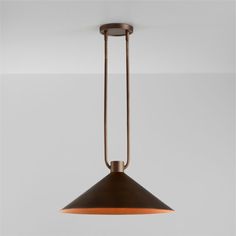 an industrial style pendant light hanging from the ceiling