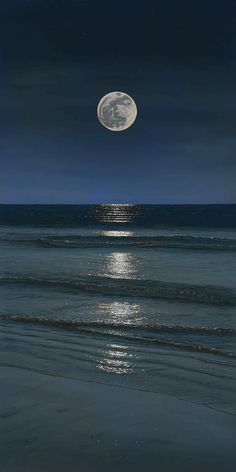 the full moon shines brightly over the ocean