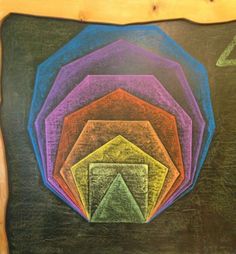 a chalk board with colored shapes on it