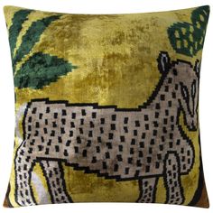 a decorative pillow with a horse on it