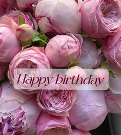 a bouquet of pink roses with the words happy birthday