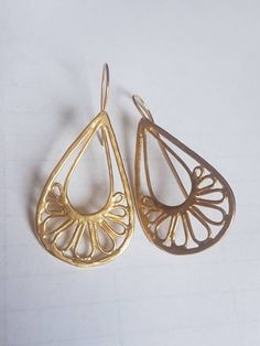 Gold teardrop earrings, filigree earrings, paisley earrings, gold lace earrings, gold earrings wedding, gold statement earrings, bridal gold earrings These filigree teardrop earrings are delicate and unique, creating a beautiful large lace teardrop by soldering wires and metal bits. They are great statement earrings for wedding and brides and are available in nickel free, 14 karat plated gold and sterling silver: see last photo, watch the short video or follow the link: https://www.etsy.com/il-e Filigree Brass Teardrop Earrings, Teardrop Brass Filigree Earrings, Brass Filigree Teardrop Earrings, Gold Teardrop Bridal Earrings With Intricate Design, Gold Filigree Drop Bridal Earrings, Gold Filigree Bridal Drop Earrings, Teardrop Bridal Earrings With Intricate Design, Wedding Gold Earrings, Bridal Gold Earrings