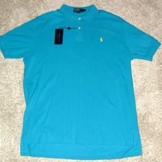 Originally Retails For $85.00 Get A Deal. Brand New Mens Sz. Xl Ralph Lauren Polo Short Sleeve Polo Shirt. The Color Is A Teal Blue.The Front Has The Embroidered Yellow Pony Logo On It. Made Of 100% Cotton Material. It Measures From Top Of Collar To Bottom Of Shirt Is 34 Inches And From Armpit To Armpit Is 25 Inches. Classic Light Blue Polo Collar Top, Blue Relaxed Fit Short Sleeve Polo Shirt, Summer Blue Relaxed Fit Polo Shirt, Relaxed Fit Blue Polo Shirt, Blue Polo Shirt With Relaxed Fit And Crew Neck, Blue Polo Collar Shirt With Relaxed Fit, Blue Relaxed Fit Polo Shirt With Crew Neck, Blue Relaxed Fit Polo Shirt, Blue Casual Polo Shirt With Crew Neck