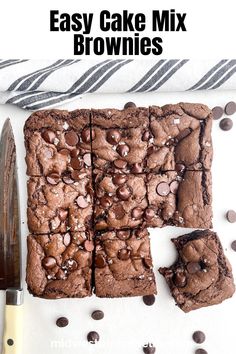 easy cake mix brownies on a white surface with chocolate chips and oreo cookies