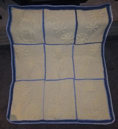 a crocheted blanket that has been made to look like a dog's paw prints