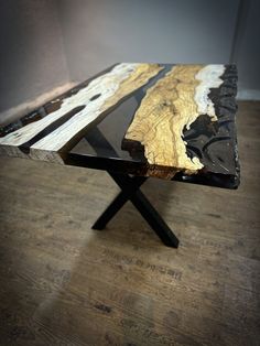 a wooden table sitting on top of a hard wood floor