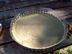 a pie pan sitting on top of a wooden table