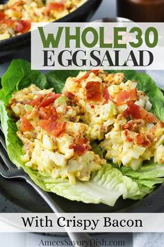 an egg salad with crispy bacon on lettuce leaves in a black bowl