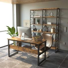 a computer desk with a laptop on top of it next to a book shelf filled with books