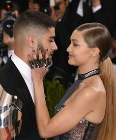 the singer and his girlfriend are posing for pictures on the red carpet at the met ball