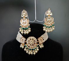 Kundanjewelsbyshiv Highlighting an excellent jewelry with Kundan setting and upgraded with remarkable dropping.Beautifully Handcrafted necklace set and Jhumki Earrings Indian Ethnic Pachi Ahemdabadi Kundan 22 Carat Gold Plated Necklace Set * This Set Is made up with High Quality Pachi Kundan * 22 Carat Gold Plating Is used * High Quality Beads Are used * Set includes Necklace,Earrings    About us: kundanjewelsbyshiv is a pioneer firm in the semi-precious jewellery business in the city of Pune. W Bollywood Beaded Choker For Diwali, Festive Beaded Choker For Diwali, Festive Heavy Choker Jewelry, Chandbali Hand Set Choker For Festivals, Heavy Festive Choker, Traditional White Hand Set Choker, Festive Cutdana Choker Jewelry, Heavy White Temple Jewelry Choker, Festive Hand Set Choker For Festivals