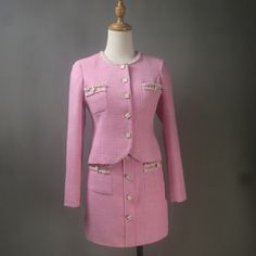 Elevate your ensemble with our exquisite Pink Tweed Skirt Suit, now available in custom-made options for plus sizes and petite sizes. This charming suit features a pink tweed skirt paired with a matching jacket adorned with delicate flower buttons, perfect for wedding guests, personalized gifts, or Easter parties where you want to exude feminine elegance and style. Features: Custom Made: Each suit set is meticulously crafted to your specific measurements, ensuring a flawless fit that accentuates Luxury Fitted Skirt Suit For Spring, Cheap Elegant Spring Skirt Suit, Luxury Tweed Skirt Suit For Work, Luxury Skirt Suit With Suit Collar For Spring, Luxury Pink Tweed Jacket For Formal Occasions, Cheap Elegant Skirt Suit, Pink Womens Skirt Suit, Luxury Pink Skirt Suit For Spring, Luxury Pink Suit Collar Sets