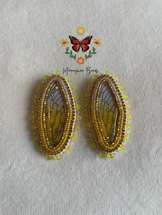 Here I got these gorgeous yellow butterfly beaded earrings.  Made with size 10 seed beads, ss6 topaz banding, 4mm yellow bicones, backed with tan Alaska split leather and is on fingernail posts.  Indigenous made on treaty 1 land. Unique Yellow Beaded Earrings For Pierced Ears, Butterfly Beaded Earrings, Beaded Butterfly Earrings, Beaded Butterfly, Yellow Butterfly, Butterfly Earrings, Jewelry Earrings Studs, Beaded Earrings, Alaska