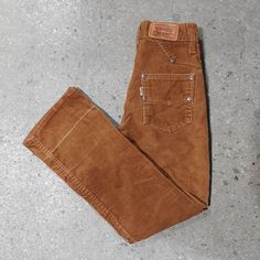 "Rare 70s Kid's Corduroy Levis Flared Jeans Warm mid-brown colour Made in USA Original Levis snap button and metal Talon zipper closure Tag sz. 10 Slim Measurements (in inches) taken flat: Waist: 11.25\" Hips: 14\" Front Rise: 9\" Back Rise: 11\" Inseam: 24\" Fade lines from where the jeans had been taken up by a previous owner and slight fading at the knee, as pictured. In otherwise excellent condition International shipping available." Levis Corduroy, 70s Levis, Kids Corduroy, Corduroy Jeans, Jeans Kids, Flared Jeans, Snap Button, Brown Color, Flare Jeans