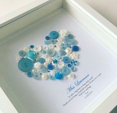 a white box with some blue and white buttons in it