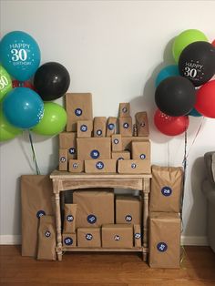 boxes and balloons are stacked on top of each other