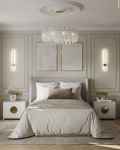 a white bed sitting in a bedroom next to two nightstands and a chandelier