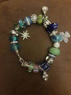 One of a kind Charm Bracelets by AmyBedazzled jewelry line. You can either buy them as is, or they can made to order by color (s) and by the type of charm (s) you want. They come in size small (7.5 inches), med (8 inches) and large (8.5 inches), and  X large (9 inches). Add some dazzle to your life! Attention Philly and South Jersey residents! To avoid shipping costs I can sell my jewelry face to face. Let me know the place and the time. Green Charms Jewelry For Friendship, Silver Jewelry With Colorful Beads For Friendship, Friendship Silver Jewelry With Colorful Beads, Green Beaded Charms Bracelets As Gift, Green Beaded Bracelets With Charms As Gift, Blue Friendship Bracelets With Charms, Green Charm Bracelet As A Gift, Blue Charm Bracelets For Jewelry Making, Green Beaded Bracelets With Lobster Clasp As Gift