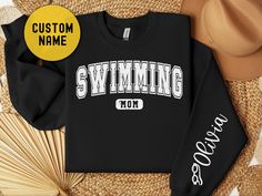 Funny custom swim mom to show your favorite swimmer support. Awesome gift for Mothers Day, Fathers day, or competition day. Funny personalized swimming life sweatshirts are the perfect gag gift. Fun way to show your daughter how much you care. Inexpensive gift idea perfect for putting a smile on her face. 🎈WELCOME TO Gifting Press If you are looking for soft, comfy, first-rate sweatshirts, you're in the right place! Here at Gifting Press, we love what we do and strive to make your shopping expe Swim Mom Shirt, Mom Shirt Ideas, Sweatshirts Cute, Name Sweater, Swim Life, Swim Mom, Mom Hoodies, Gift For Mothers Day, Inexpensive Gift