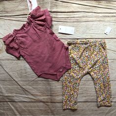 Mauve Pink Onesie With Matching Floral Leggings. Playful Matching Sets For Spring, Playful Spring Matching Sets, Playful Stretch Sets For Spring, Cute Purple Spring Sets, Pink Matching Set Bottoms For Spring, Spring Stretch Purple Sets, Spring Purple Stretch Sets, Playful Playwear Sets For Spring, Playful Spring Playwear Sets