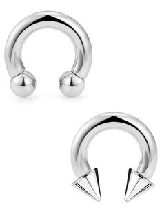 two pairs of stainless steel piercings with spikes on each side and one pair in the middle