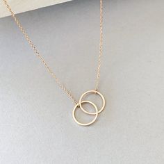 "Beautiful simple and everyday necklace~ Interlocking Circle Necklace, Double Circle Pendant Necklace, Entwined Ring Necklace, Minimalist Gift for Her, Couple Sister Necklace DESCRIPTION: Necklace lengths 17 inches. - Interlocking Circle pendantapprox. 1\" in length -16K Gold, Silver, Rose gold Plated Double Circle Charm size: 1\" -16K Gold, Silver, Rose gold Plated dainty chain and lobster clasp" Necklace To Put Ring On, Two Ring Necklace, Minimalist Infinity Clavicle Chain Necklace, Minimalist Infinity Jewelry With Delicate Chain, Minimalist Circle Necklace For Anniversary, Minimalist Infinity Necklace With Delicate Chain, Minimalist Infinity Necklace For Everyday, Minimalist Circle Chain Necklace Gift, Delicate Chain Necklace With Open Circle For Gift