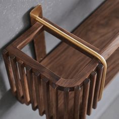 a wooden chair with a metal handle on it