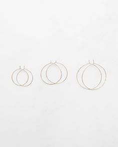 14K gold wire hammered and shaped into hoop earrings. Small earrings measure 1.5" in diameter. Medium hoops measure 2" in diameter. Large hoops measure 2.5" in diameter. Sold as a pair. See photo on model for sense of scale. First model wearing large hoops, second model wearing medium hoops. Plastic backs are included and encouraged. This piece is handmade in the Hudson Valley and Block Island, RI without the use of heat or chemicals. All Mary MacGill jewelry is crafted with inherently unique st Minimal Hoop Earrings, Block Island, Gold Wire, Small Earrings, Hudson Valley, Baroque Pearls, Jewelry Care, Chemicals, Sense