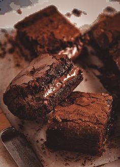 some brownies are on a cutting board with a knife