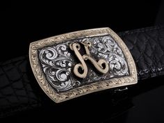 The Branson Initial by Comstock Heritage is an extra heavy distressed Branson shape, featuring an intricate 14k yellow gold hand cut initial in the center. Your letter is surrounded by deep cut, hand etched engraving for a bold look. The whole buckle is framed with a matching 14k engraved wide border. Measures 3" x 1 ⅞” This set is for a 1 ¼" belt Gold Hand, Gold Hands, Shot Glasses, Gift Accessories, Turquoise Stone, Belt Buckles, Customized Gifts, Belts, Mens Jewelry