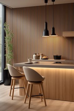 a modern kitchen with wood paneling and stools in front of the countertop