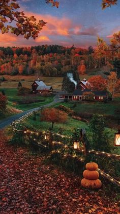 an autumn evening in the country with lights strung from trees