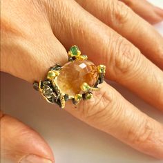 Main Stone: Citrine; Small Stones: Emeralds; 925 Sterling Silver; Black Radium Plated; Parts: Yellow Gold Plated; “Fly” Design. Size: 6 Elegant Citrine Rings With Natural Stones, Unique Citrine Rings With Gemstone Accents, Elegant Handmade Yellow Rings, Unique Yellow Citrine Jewelry, Handmade Yellow Citrine Rings, Luxury Handmade Yellow Rings, 925 Silver Ring, Lemon Quartz, 925 Silver Rings