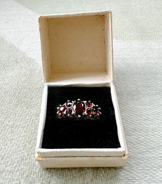 Victorian Sterling Silver Garnet Cluster ring, 7 Garnets in total, one centre set oval garnet 7mm with three round cut Garnets each side, gross weight 2.65 grams. UK Ring size L1/2. Ring in good condition. Cluster Ring, Last Minute Gifts, Rings Statement, Sterling Silber, Round Cut, Statement Rings, Garnet, Jewelry Rings, Ring Size