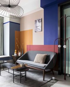 a living room with colorful walls and furniture